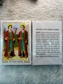 SÃO COSME E DAMIÃO - PACOTE C/ 100 SANTINHOS DE PAPEL