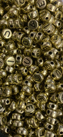 VOGAIS REDONDAS DOURADAS 07MM ( PACOTE COM 50GR)