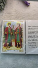 SÃO COSME E DAMIÃO - PACOTE C/ 100 SANTINHOS DE PAPEL