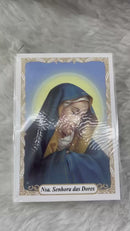 NOSSA SENHORA DAS DORES - PACOTE C/ 100 SANTINHOS DE PAPEL